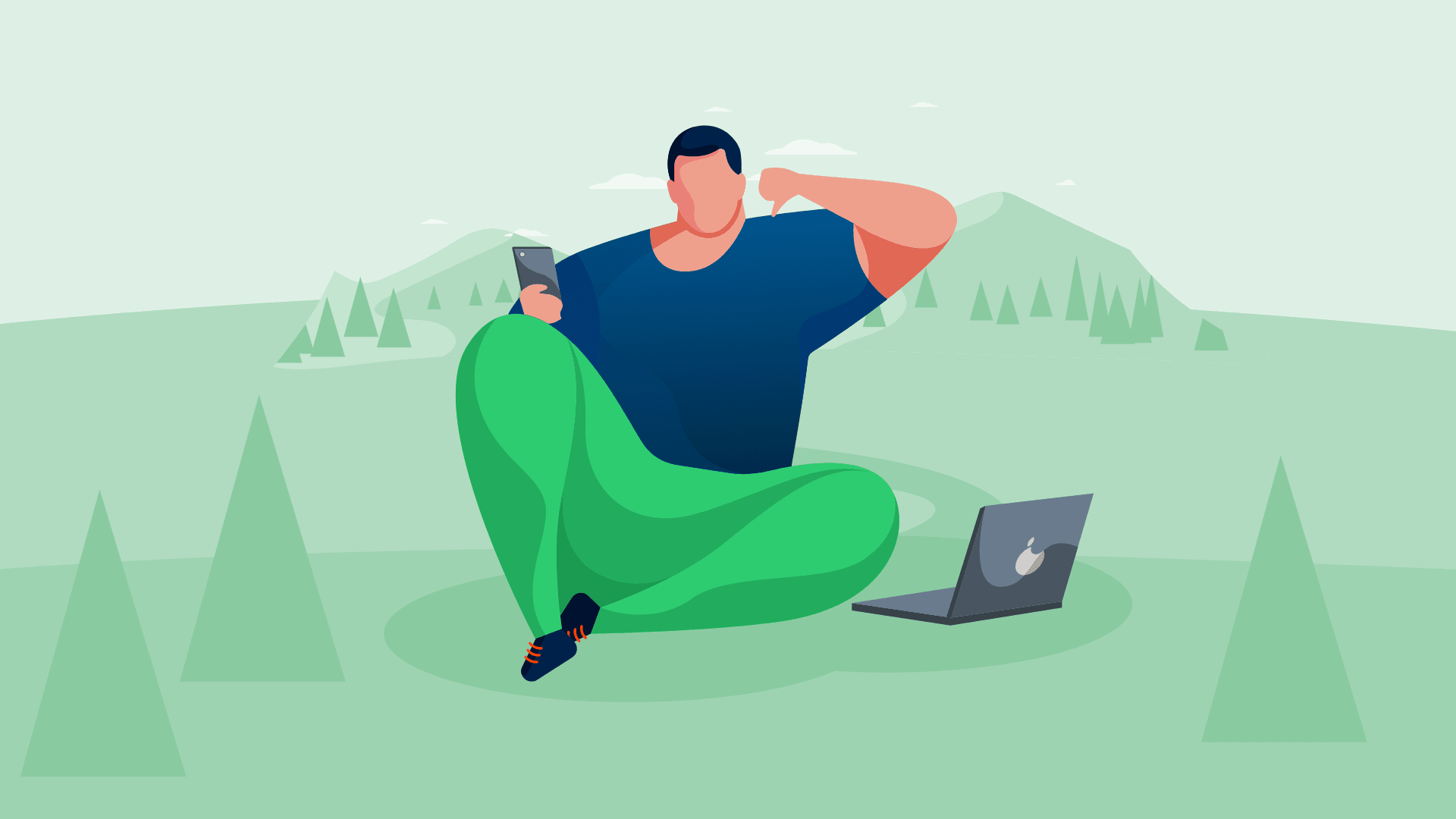 A man with laptop working outside in nature.
