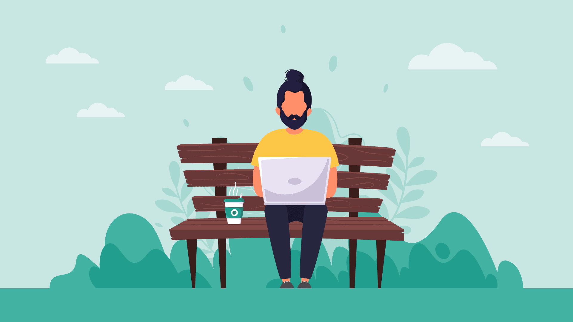 A hipster guy with a man bun and a laptop working outside.